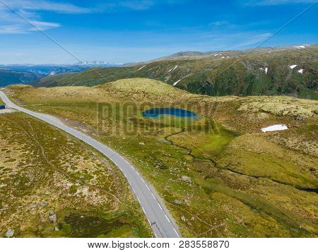 Mountain Region Between Aurland And Laerdal In Norway. Rocky Landscape With Road. National Tourist S