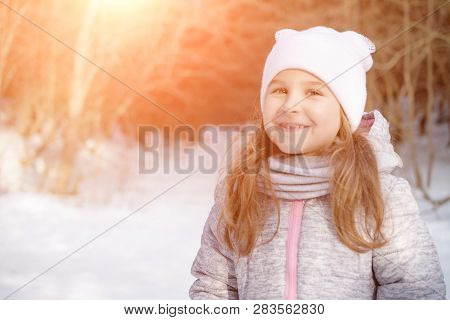 Portrait Of A Cute Little Girl In Forest