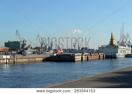 Commercial Port, Shipping Conteiners Terminal And Freight Cranes