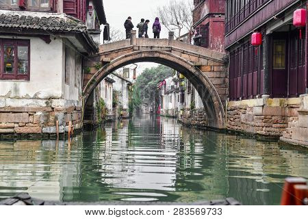 Zhouzhuang,jiangsu,china - December 14 2018 : Unknown People On An Old Bridge At Zhouzhuang, Is A To