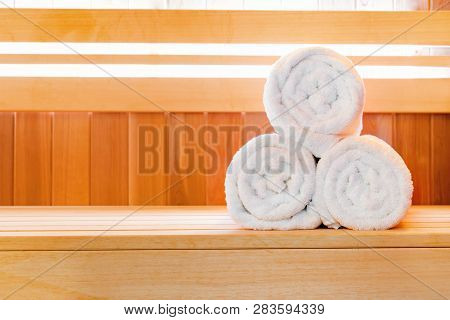 Traditional Finnish Wooden Sauna For Relaxation With Bucket Of Water And Set Of Clean Towels