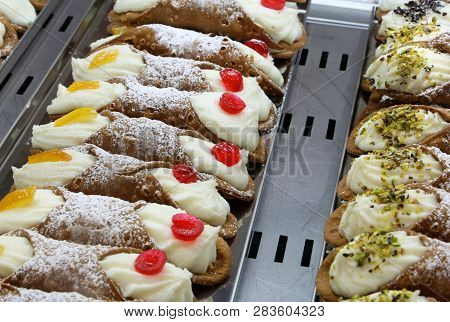 Many Typical Pastries For Sale In Sicily In Italy Called Sicilian Cannoli In Italian Language