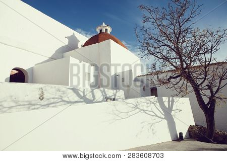 Mediterranean Traditional Architecture In Ibiza: Beautiful Church Of Santa Eularia Des Riu In Ibiza 