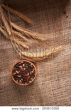 Bowl Of Various Pepper Peppercorns Seeds Mix On Table Rastic Style Background