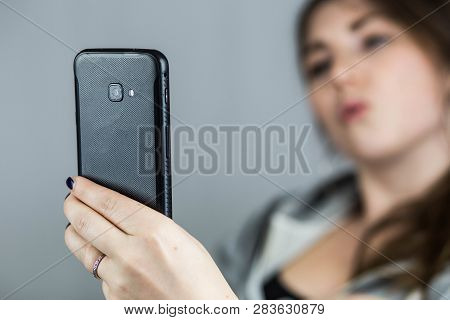 Teen Girl Taking Selfie With Duckface With Her Mobile Phone