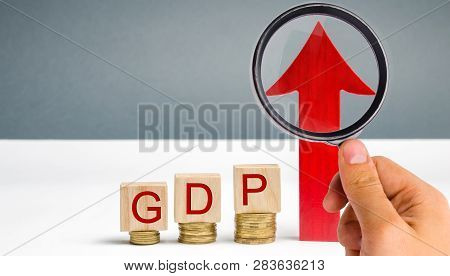 Wooden Blocks With The Word Gdp And Up Arrow. Technological Progress, Increasing The Level Of Worker