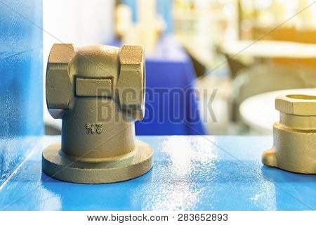 Industrial Casting Parts Water T Joint Copper Or Brass Fittings On Blue Table