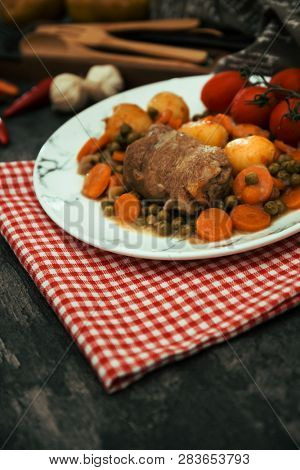 Beef meat stewed with potatoes-Traditional French cuisine Beef Bourguignon potatoes carrots in persillade