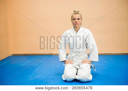Young Girl Dressed In Hakama Practicing Aikido.