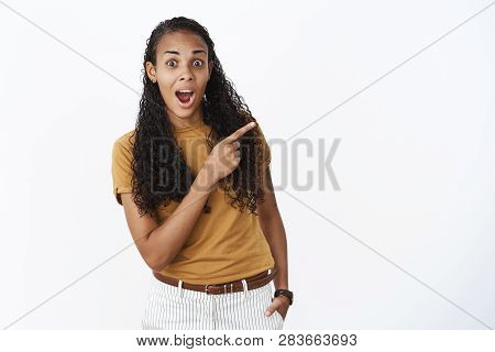 Impressed And Surprised Happy Young African American Female Student Astonished With Cool Amazing Pro