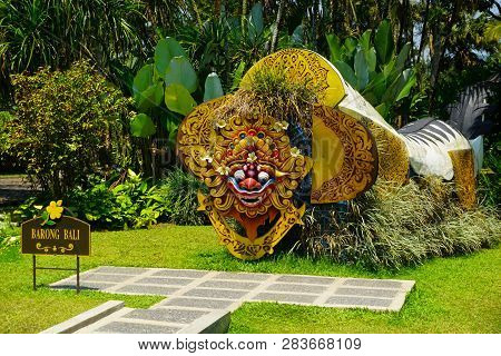 Bali Barong From Indonesia On The Middle Of Garden Park With Green Grass And Background - Photo Indo