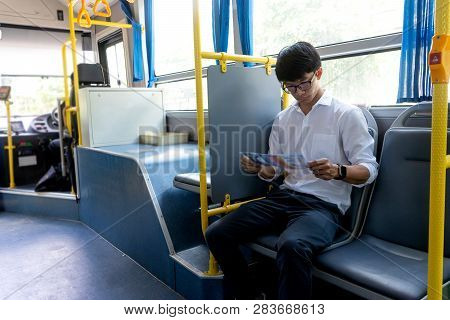 Young Businessman Passenger Use Time In The Bus