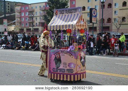 LOS ANGELES - FEBRUARY 9, 2019: Golden Dragon Parade in the streets of China Town Los Angeles. Chico McRooster and his people perform wave and visit with guest at the Chinese New Year celebration.

