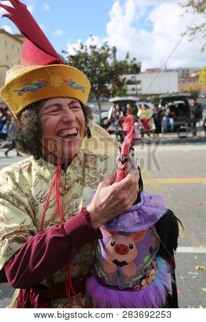 LOS ANGELES - FEBRUARY 9, 2019: Golden Dragon Parade in the streets of China Town Los Angeles. Chico McRooster and his people perform wave and visit with guest at the Chinese New Year celebration.

