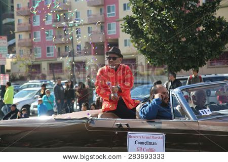 LOS ANGELES - FEBRUARY 9, 2019: Golden Dragon Parade in the streets of China Town Los Angeles. Councilman Gil Cedillo waves to the crowd at the Chinese New Year celebration 2019.

