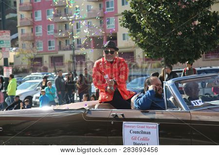 LOS ANGELES - FEBRUARY 9, 2019: Golden Dragon Parade in the streets of China Town Los Angeles. Councilman Gil Cedillo waves to the crowd at the Chinese New Year celebration 2019.

