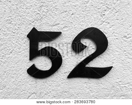 The Number Of Street Address With Number 52 Closeup.