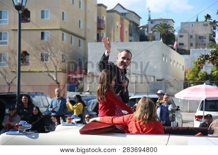 LOS ANGELES - FEBRUARY 9, 2019: Golden Dragon Parade in the streets of China Town Los Angeles. Los Angeles Mayor Eric Garcetti waves to the crown during the Chinese New Year celebration 2019.

