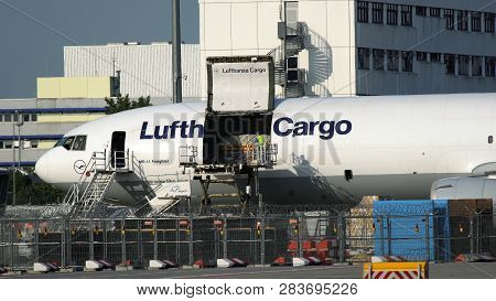 Frankfurt Am Main, Germany - July 19, 2017: Side View Of Airport Serviceman Standing On Landing Plat