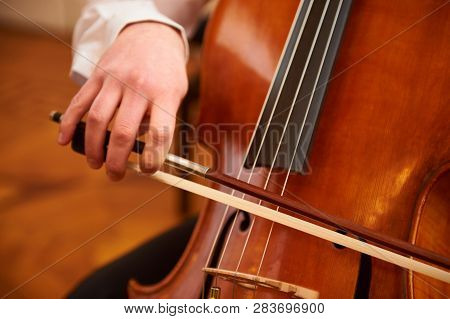 One Cellist Performing A Cello Piece