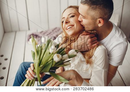 Cute And Elegant Family In A White Rom