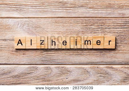 Alzheimer Word Written On Wood Block. Alzheimer Text On Wooden Table For Your Desing, Concept