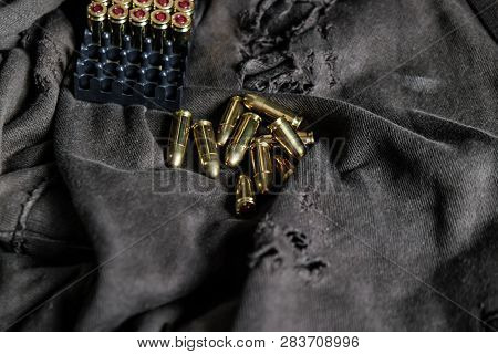 Fmj 9Mm Automatic Pistol Ballistic On Cloth Background