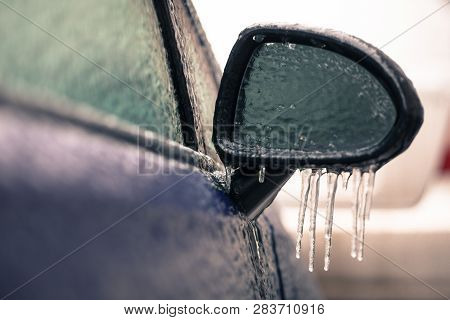 Close Up Shot Of A Frozen Car Mirror After Freezing Rain.