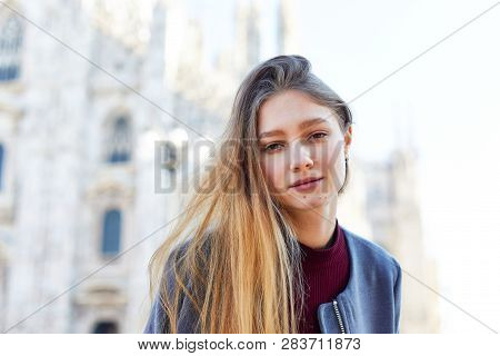 Tourist Girl Daydreming In Front Of Duomo Of Milan Italy