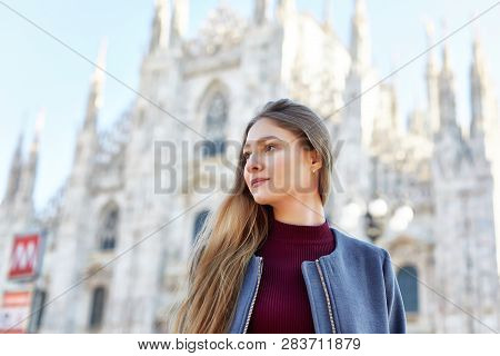 Tourist Girl Daydreming In Front Of Duomo Of Milan Italy