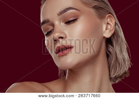 Young Appealing Blonde-haired Woman With Nice Hairstyle