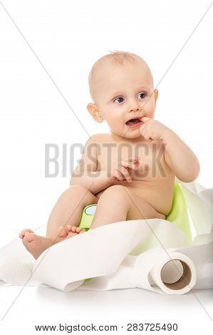 Funny Child Sitting On Chamberpot With A Roll Of Toilet Paper, Children's Legs Hanging Down From A C