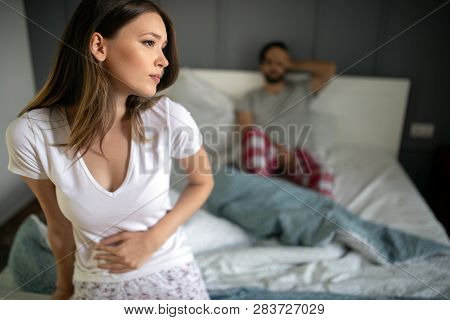 Sad, Upset, Unhappy Woman Holding Hands On Stomach Suffering From Stomach Pain