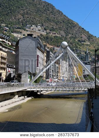 The River Valira And The Bridge La Vella
 Mountains In The Background Of The Pyrenees, Andorra.