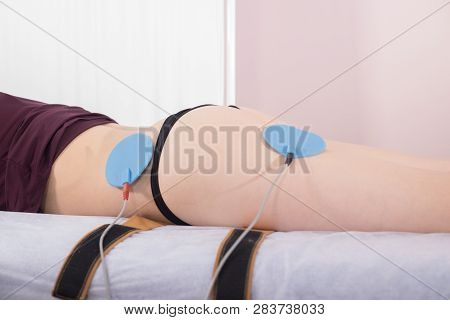 Close-up Of Young Woman Taking Myostimulation, Side View