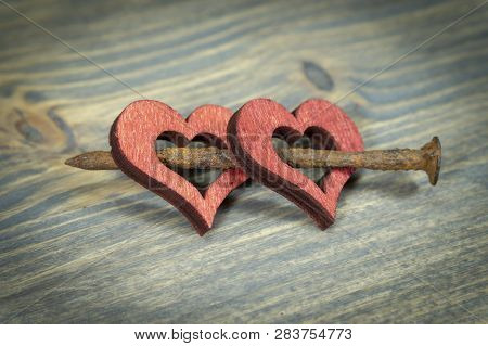 Wooden Hearts With Rusted Nail