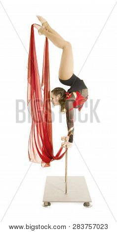 Flexible Equilibrist Performs Exercises On Acrobatic Walking Sticks.
