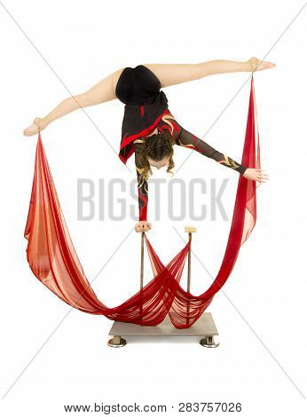 Flexible Equilibrist Performs Exercises On Acrobatic Walking Sticks.