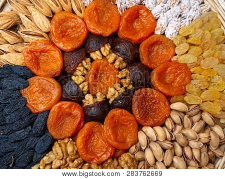 Dried Apricots Raisin Nuts Background. Concept Of Healthy Food For Heart And Brain