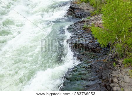 The Spokane River In Spring Flood Near Downtown Spokane, Washington, Usa