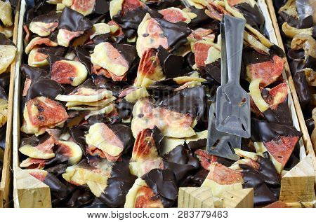 Small Slices Of Dried Watermelon Covered With Chocolat For Sale At Italian Market