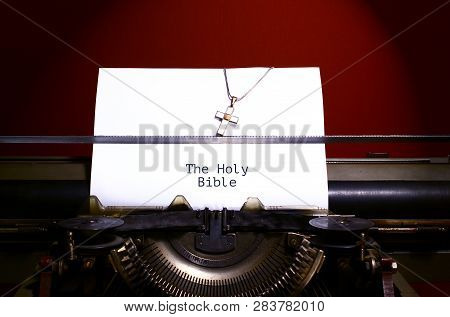 Holy Bible Writen On Paper By Vintage Typewriter. Cross Necklace