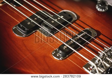 Guitar Body. Close-up View Of Electric Guitar Body With Metal Strings And Pickups. Musical Instrumen