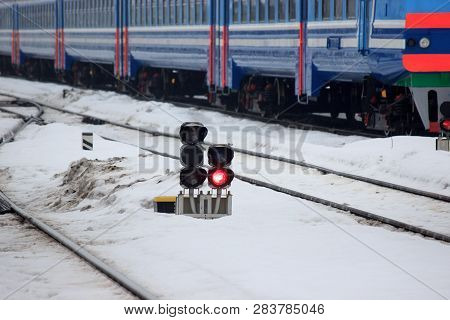 Railway Traffic Light On The Background Of A Modern Train. Fast Train At The Railway Station, Will T