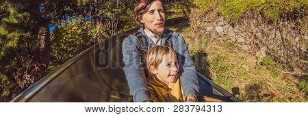Dad And Son Have Fun On Alpine Roller Coaster Banner, Long Format