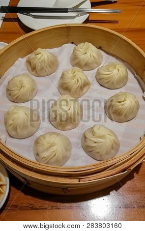 Chinese Steamed Steamed Bun (baozi) Named Xiaolongbao Also Called A Soup Dumpling. It Is Traditional