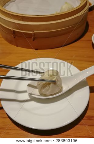 Chinese Steamed Steamed Bun (baozi) Named Xiaolongbao Also Called A Soup Dumpling. It Is Traditional