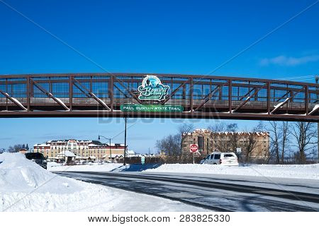 Bemidji, Mn - 8 Feb 2019: Welcome Sign On Bike Trail Bridge In Winter With Hotels In Background.