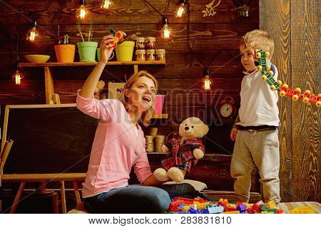 Daycare Concept. Little Child Play Daycare Game With Woman. Daycare Preschool. Family Daycare. Fun P