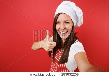 Housewife Female Chef Cook Or Baker In Striped Apron, White T-shirt, Toque Chefs Hat Isolated On Red